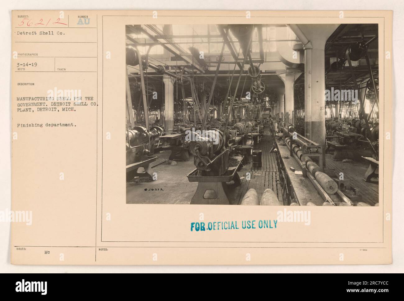 Employees at Detroit Shell Co. in Detroit, Michigan, working in the finishing department, manufacturing shells for the government during World War I. This photograph, taken on March 14, 1919, was used for official purposes and is marked as subject number 56212. Stock Photo