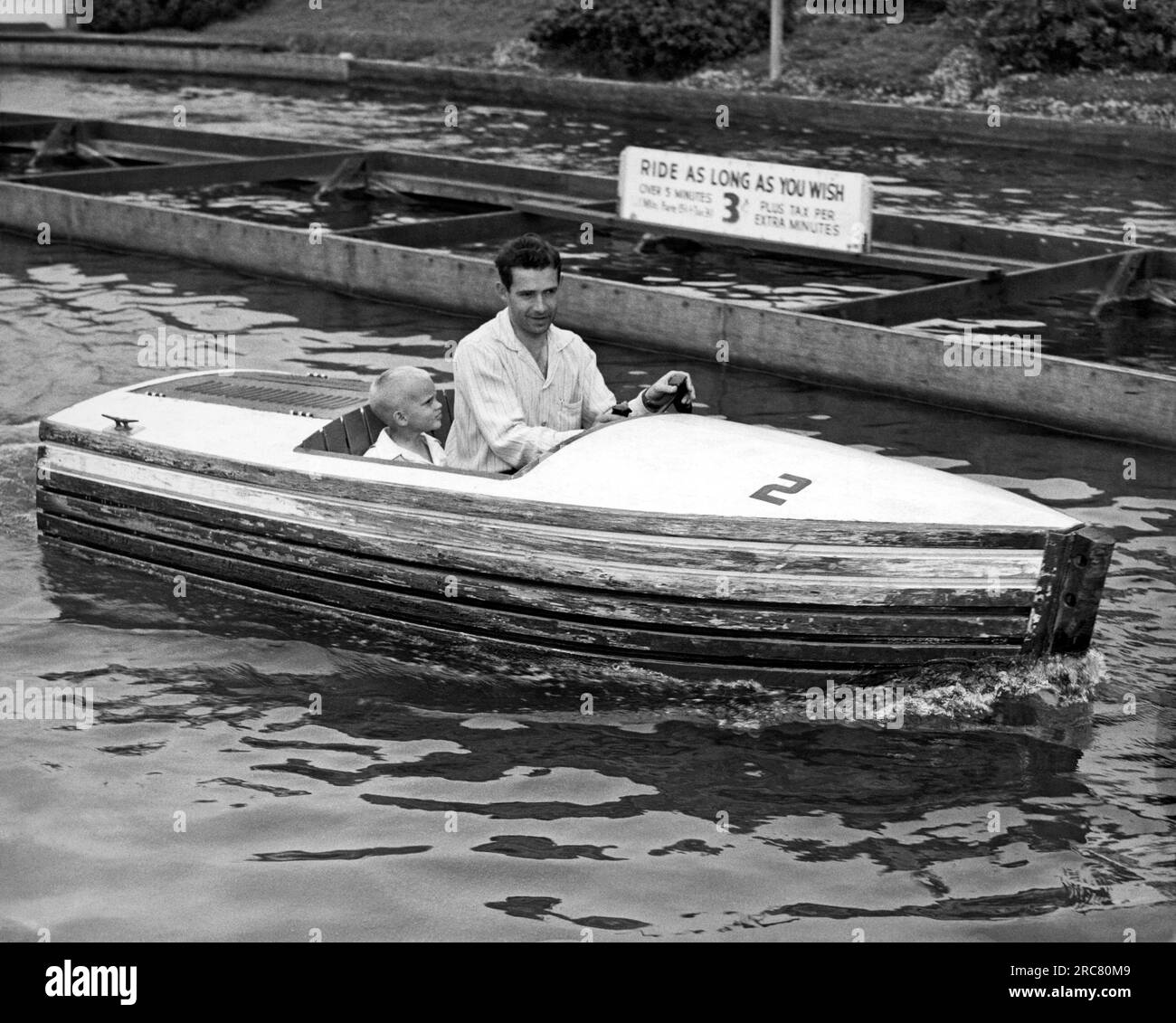 San Francisco, California c. 1955 A father and his son take a spin on a