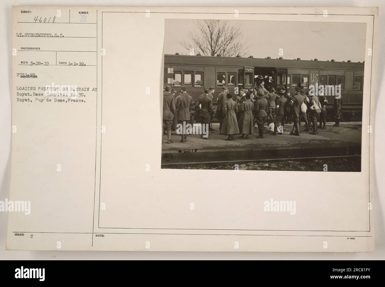 Soldiers at Base Hospital No. 30 in Royat, France, loading patients onto a D. Train. Lieutenant Strohmeyer, serving with the SC, photographed the activity on March 28, 1919. This image is numbered 2 in the series taken on January 1, 1919. The photograph is part of the collection 'Photographs of American Military Activities during World War One.' Stock Photo