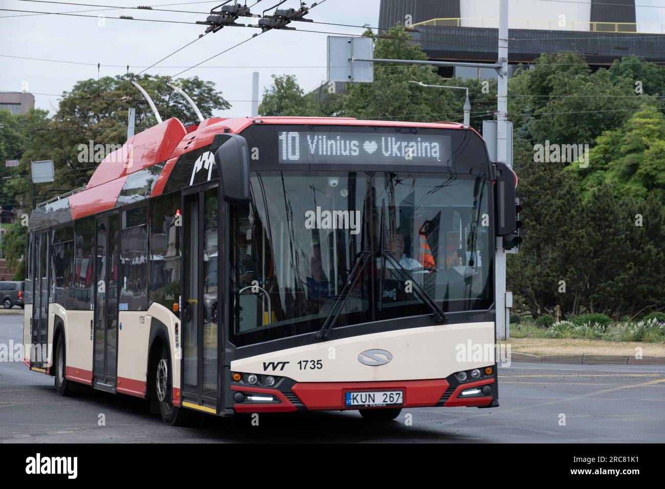 Skoda Trolley Bus in a street in Vilnius, Lithuania. Public Transport with text 'Vilnius loves Ukraina' Stock Photo