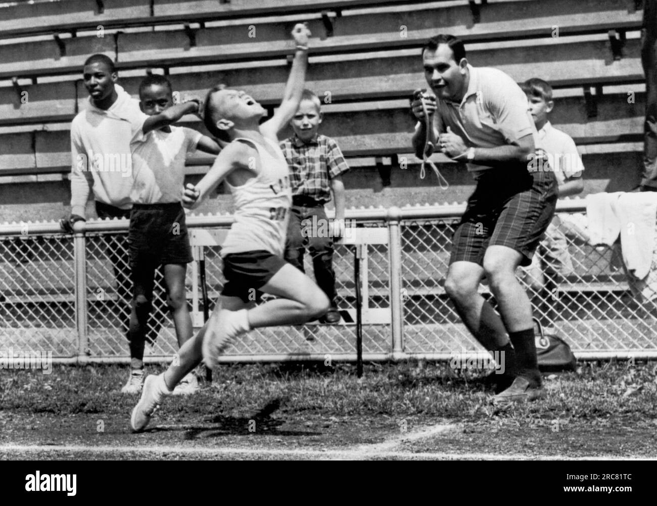 St. Louis, Missouri June 9, 1962 A young athlete gives it his all in a