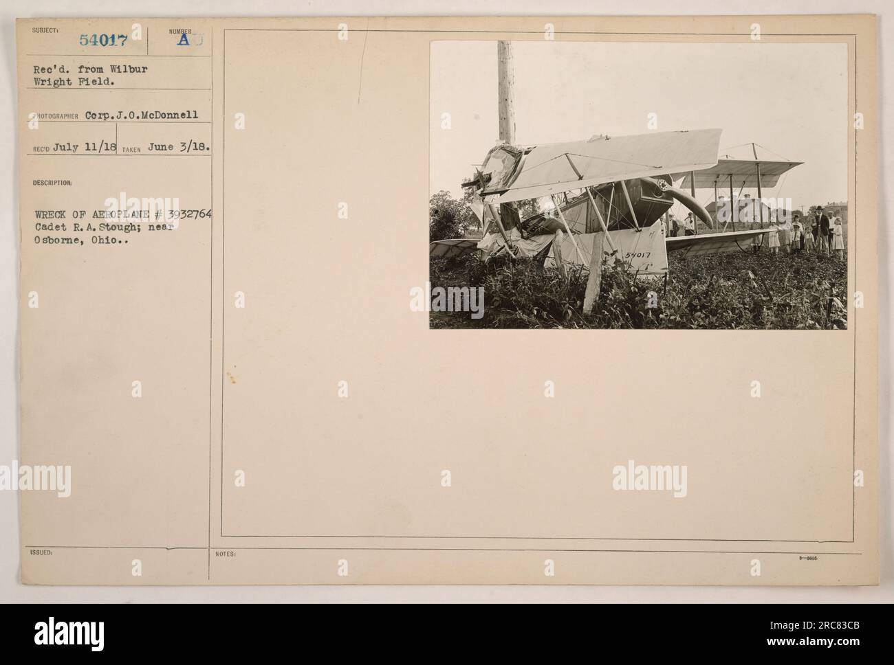 This photograph shows the wreck of Aeroplane #3932764, belonging to Cadet R.A. Stough, near Osborne, Ohio. It was received from Wilbur Wright Field and taken on June 3, 1918, by Corporal J.O. McDonnell. The photo was issued with the notes reference number 54017. Stock Photo