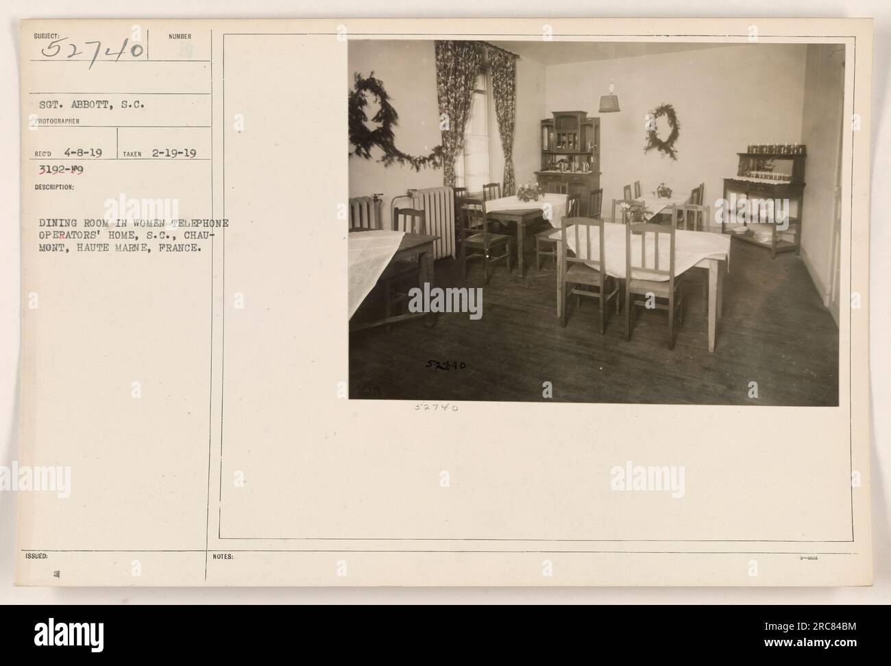 Caption: Dining room in women telephone operators' home at S.C. Chaumont, Haute Marne, France. The photograph, taken on February 19, 1919, showcases the living conditions of the Hello Girls during World War I. Sergeant Abbott, an Signal Corps photographer, captured this image, which was later issued as part of the military records. Stock Photo