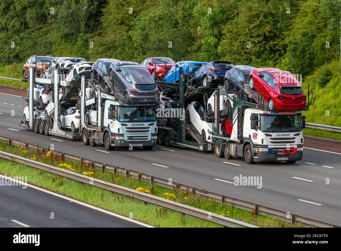BCA British Car Auctions car transporter, Lorries & Trucks, shipping freight, heavy haulage, lorry logistics, collection and deliveries, Scania delivery transport vehicles on the M6, Manchester, UK Stock Photo