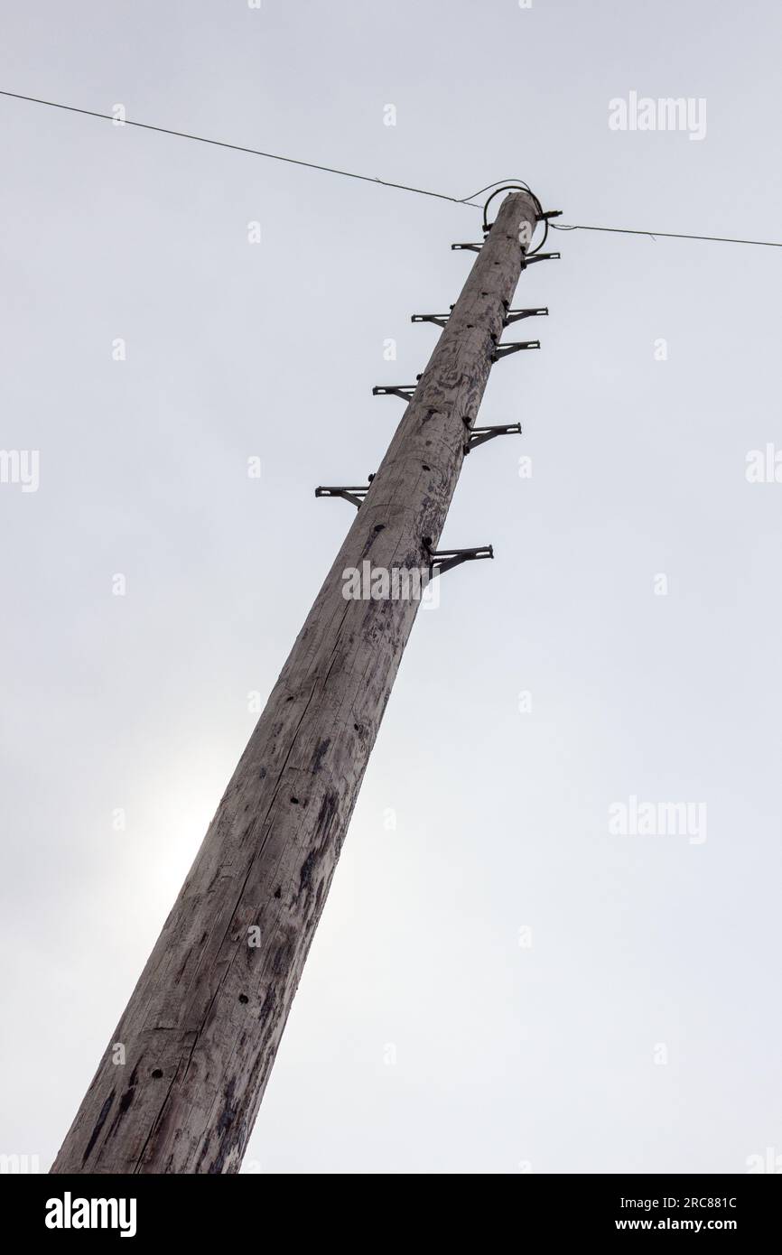 Looking up the rungs of a electricity pole Stock Photo