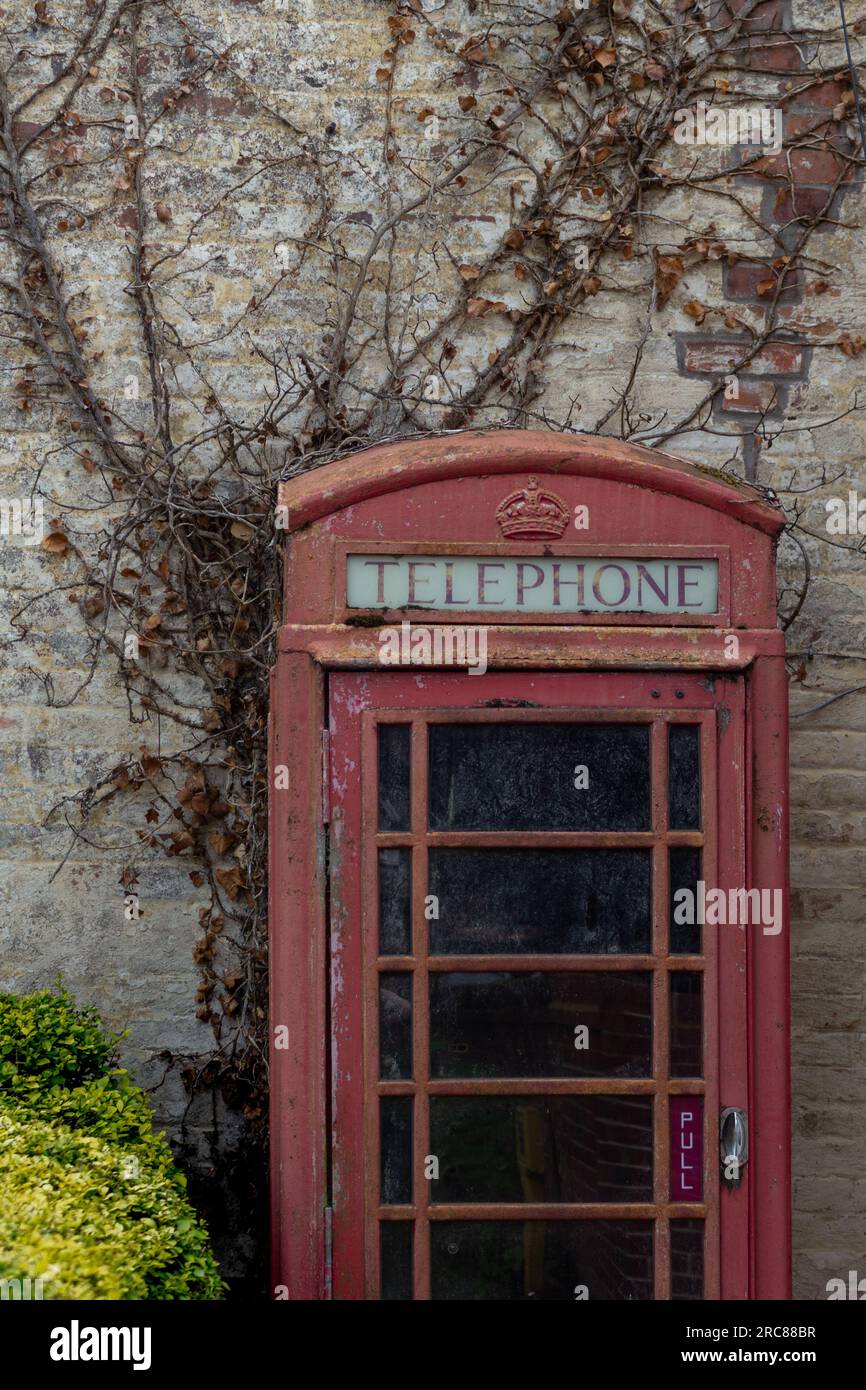A disused Gilbert Scott Mk6 GPO red telephone kisok in a village in Norfolk, England Stock Photo