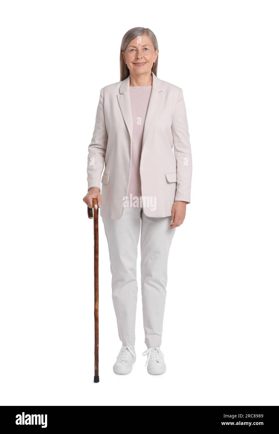 Senior woman with walking cane on white background Stock Photo - Alamy