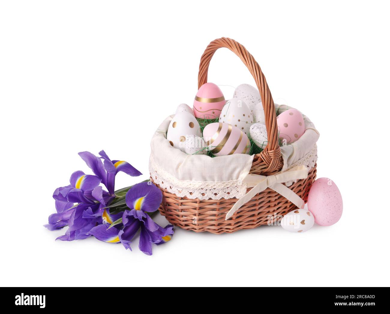 Wicker basket with beautifully painted Easter eggs and iris flowers ...
