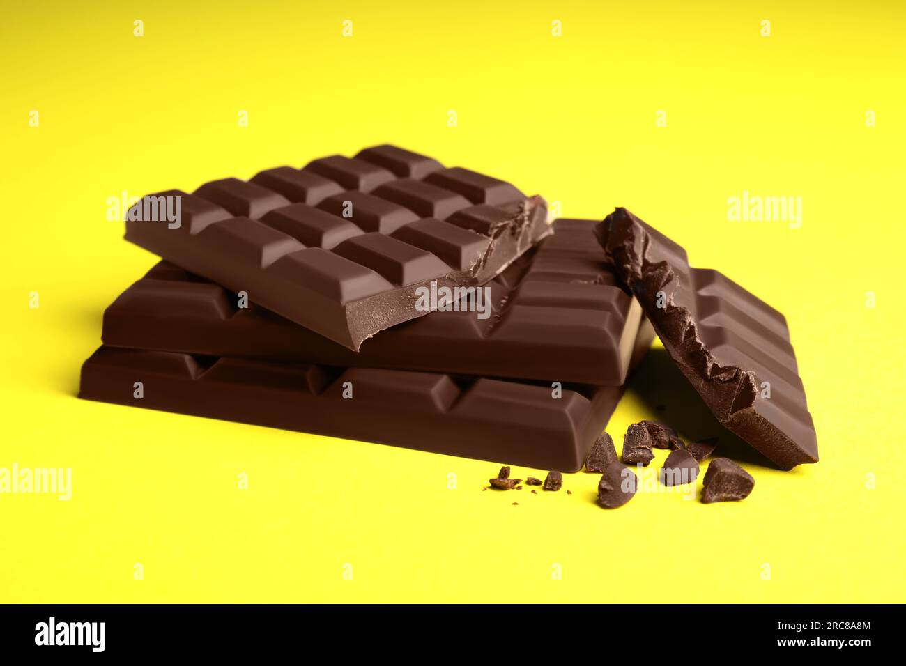 Delicious dark chocolate bars on yellow background Stock Photo Alamy