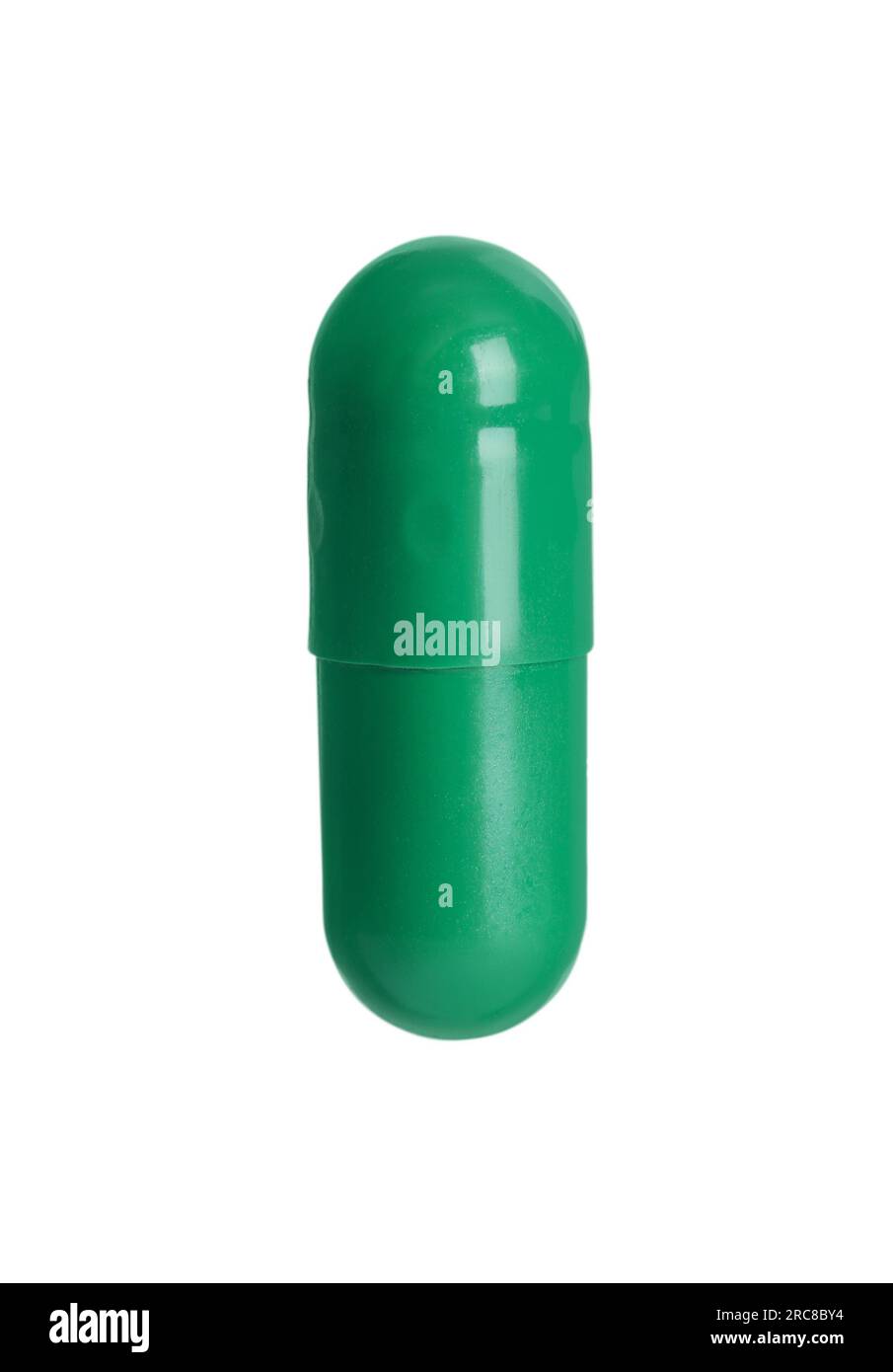 One green pill on white background. Medicinal treatment Stock Photo Alamy