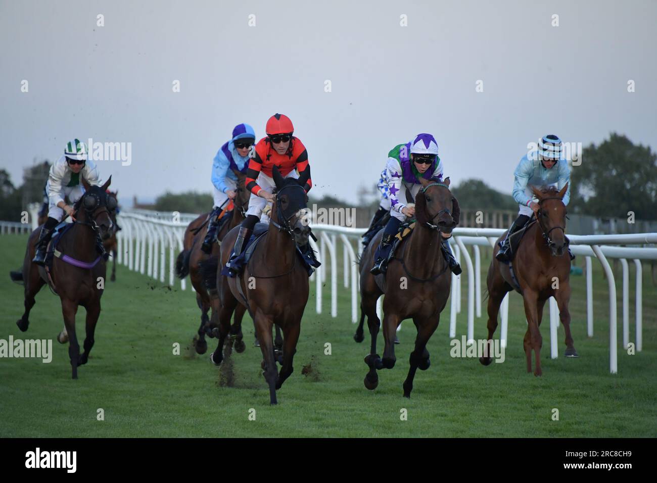 Bath, UK. 12th July 2023. Blue Hero (red cap), ridden by Finley Marsh, wins the 120.45 Blackmore Building Contractors Handicap at Bath Racecourse, UK. Credit: Paul Blake/Alamy Live News. Stock Photo