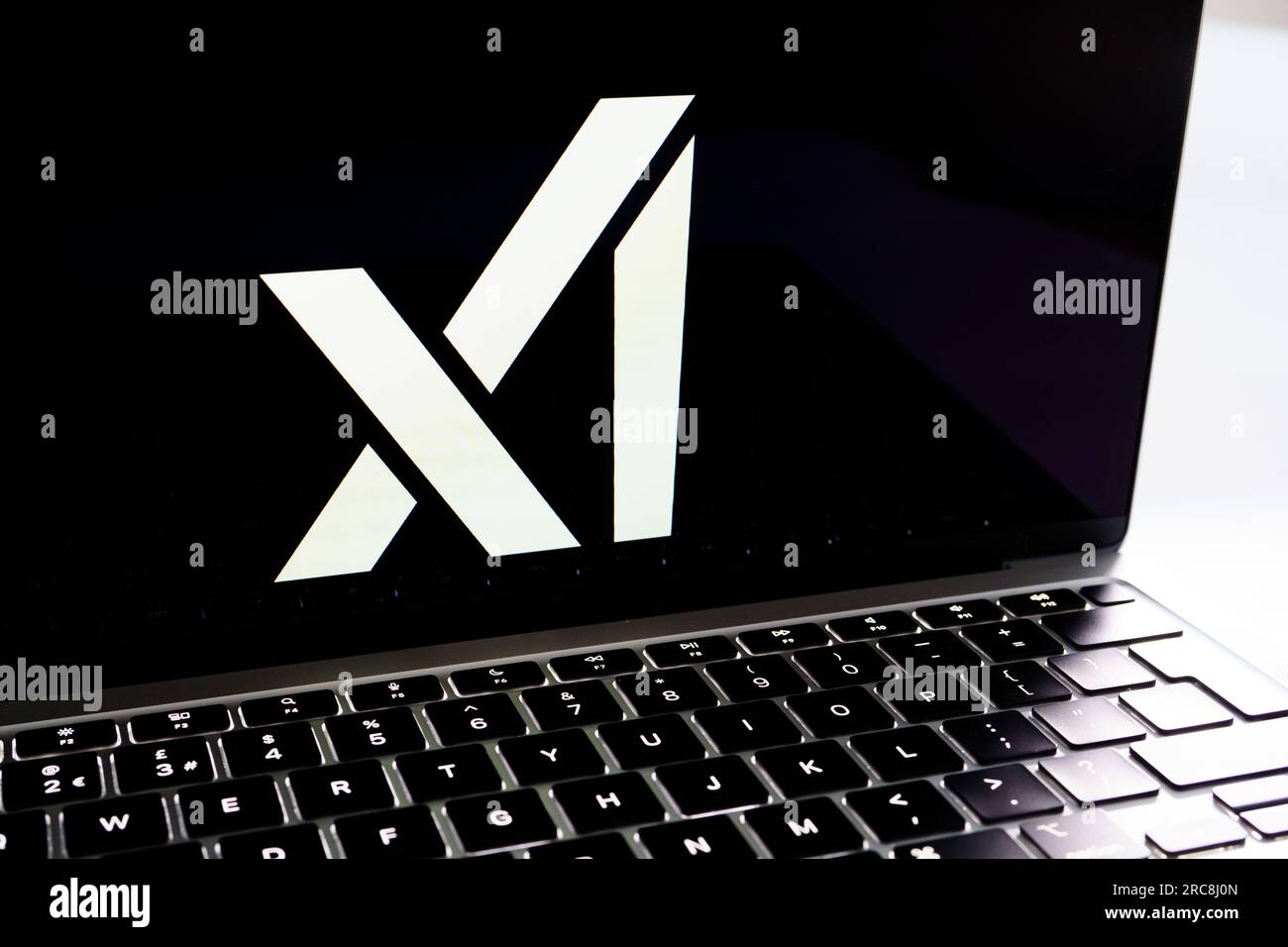 xAI company logo seen on the screen. Elon Musk created artificial