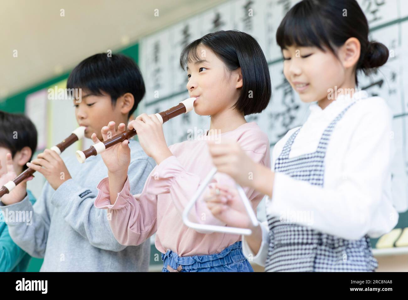 Elementary school students practicing the recorder Stock Photo Alamy