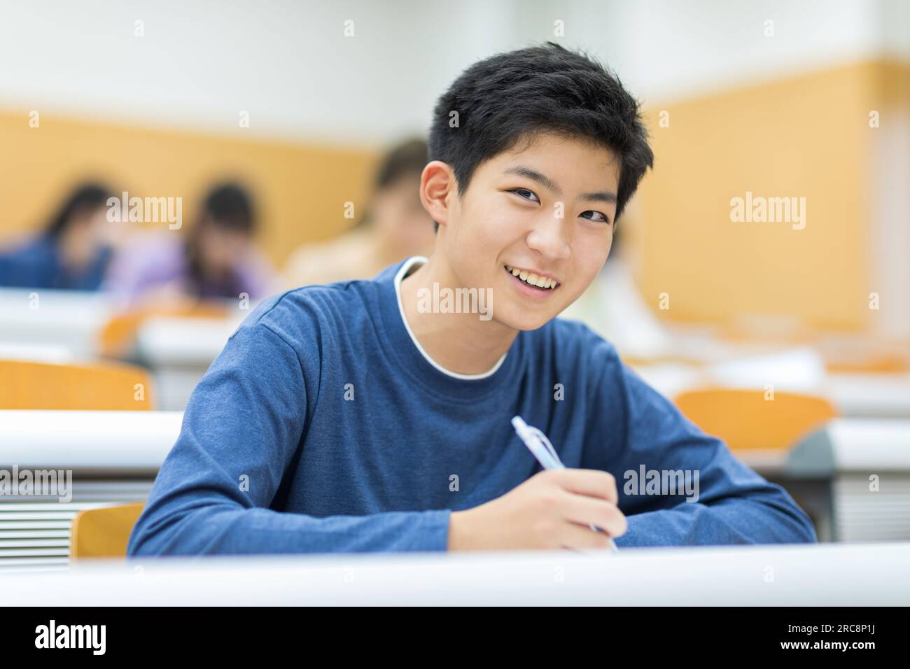 University students receiving a lecture Stock Photo - Alamy image.