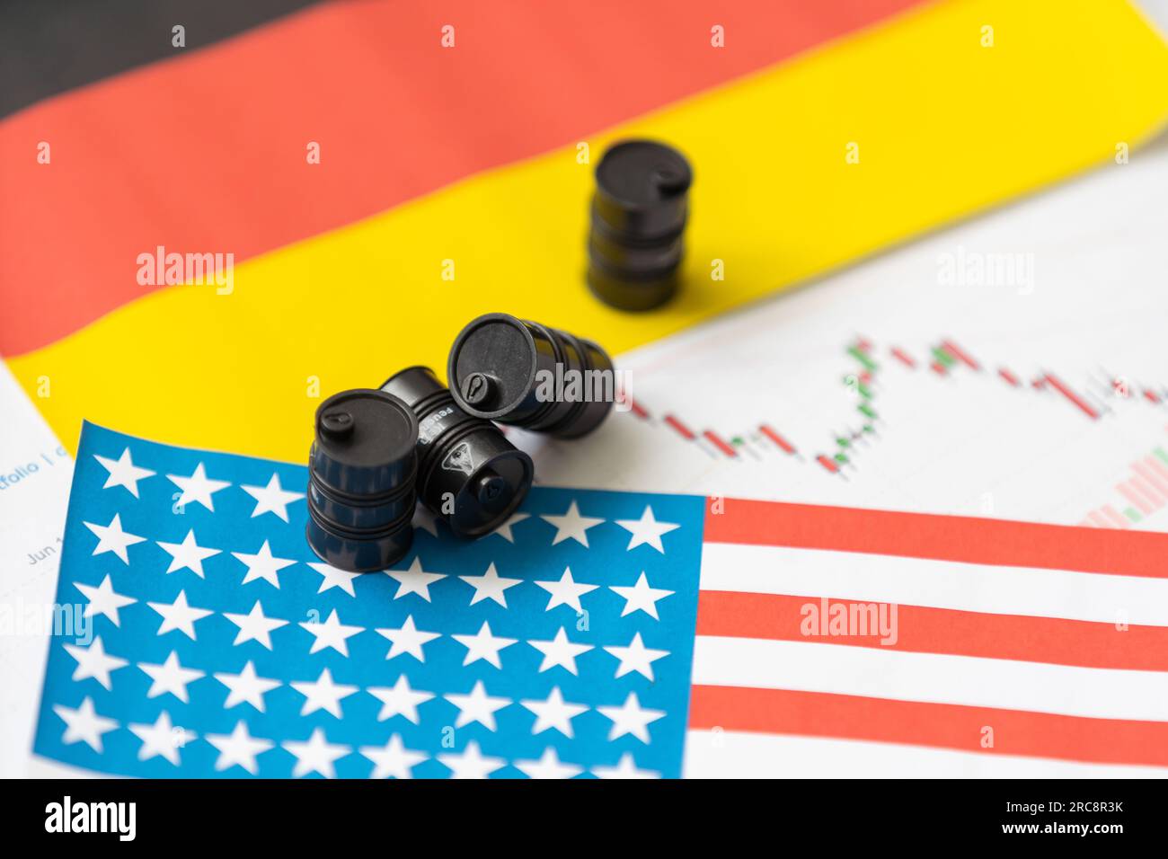 Oil drums on US dollars background Stock Photo