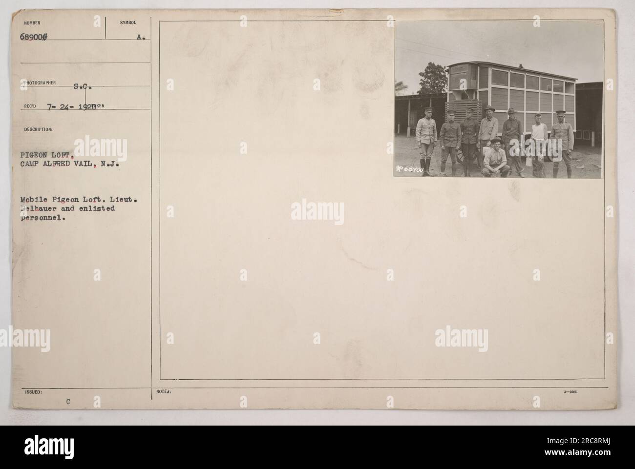 A mobile pigeon loft at Camp Alfred Vail in New Jersey. Lieutenant Delhauer and enlisted