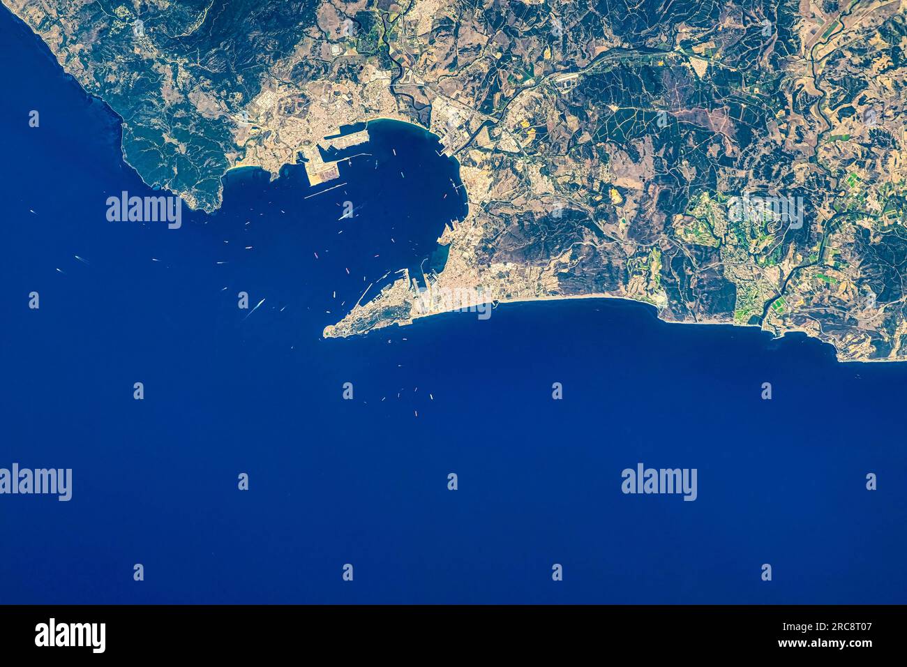 Bay and peninsula of Gibraltar. Water's edge or coastal area. Image by NASA. Media usage