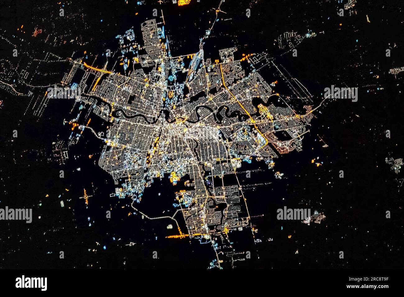 Aerial view of Winnipeg city lights at night, Canada. Image by NASA. Media usage guidelines: https://www.nasa.gov/multimedia/guidelines/index.html Stock Photo