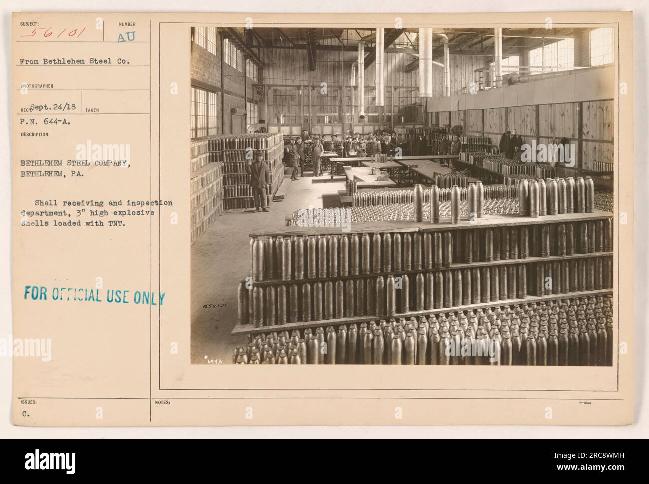 In the photograph, taken by the photographer of Bethlehem Steel Company on September 24, 1918, at Bethlehem, PA, the shell receiving and inspection department is shown. The image depicts 3' high explosive shells loaded with TNT. The photograph is labeled as 'FOR OFFICIAL USE ONLY' and bears the issue 'C. NOTES' as additional information. Stock Photo