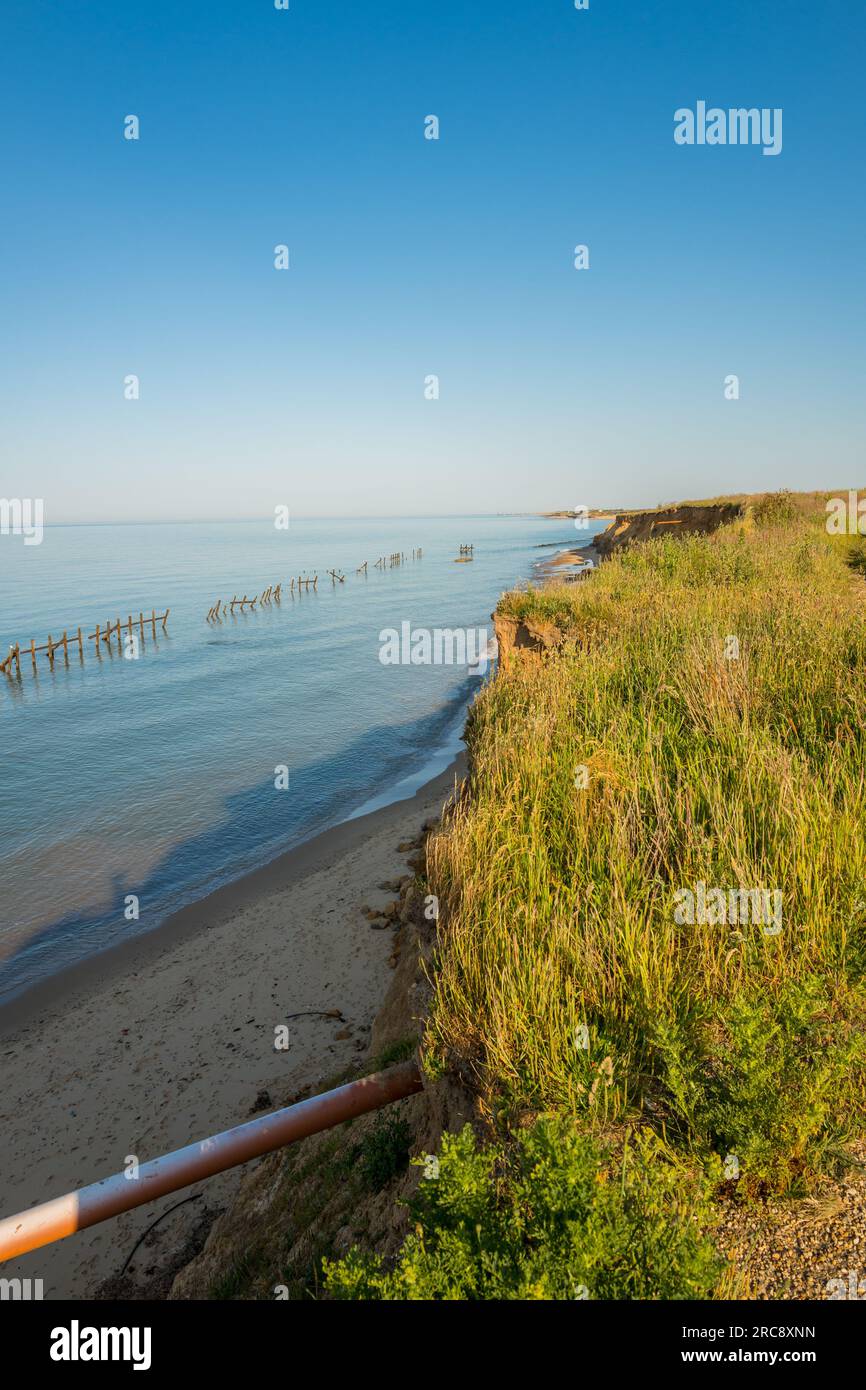 Sea defences and land erosion on the North sea coast at Happisburgh in Norfolk, England Stock Photo