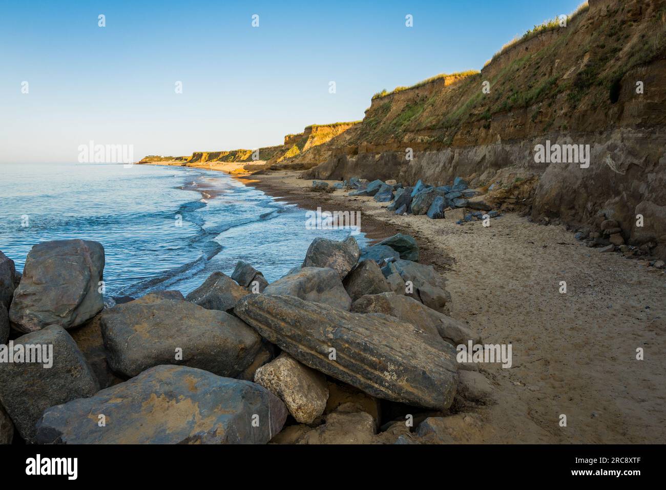 Sea defences and land erosion on the North sea coast at Happisburgh in Norfolk, England Stock Photo