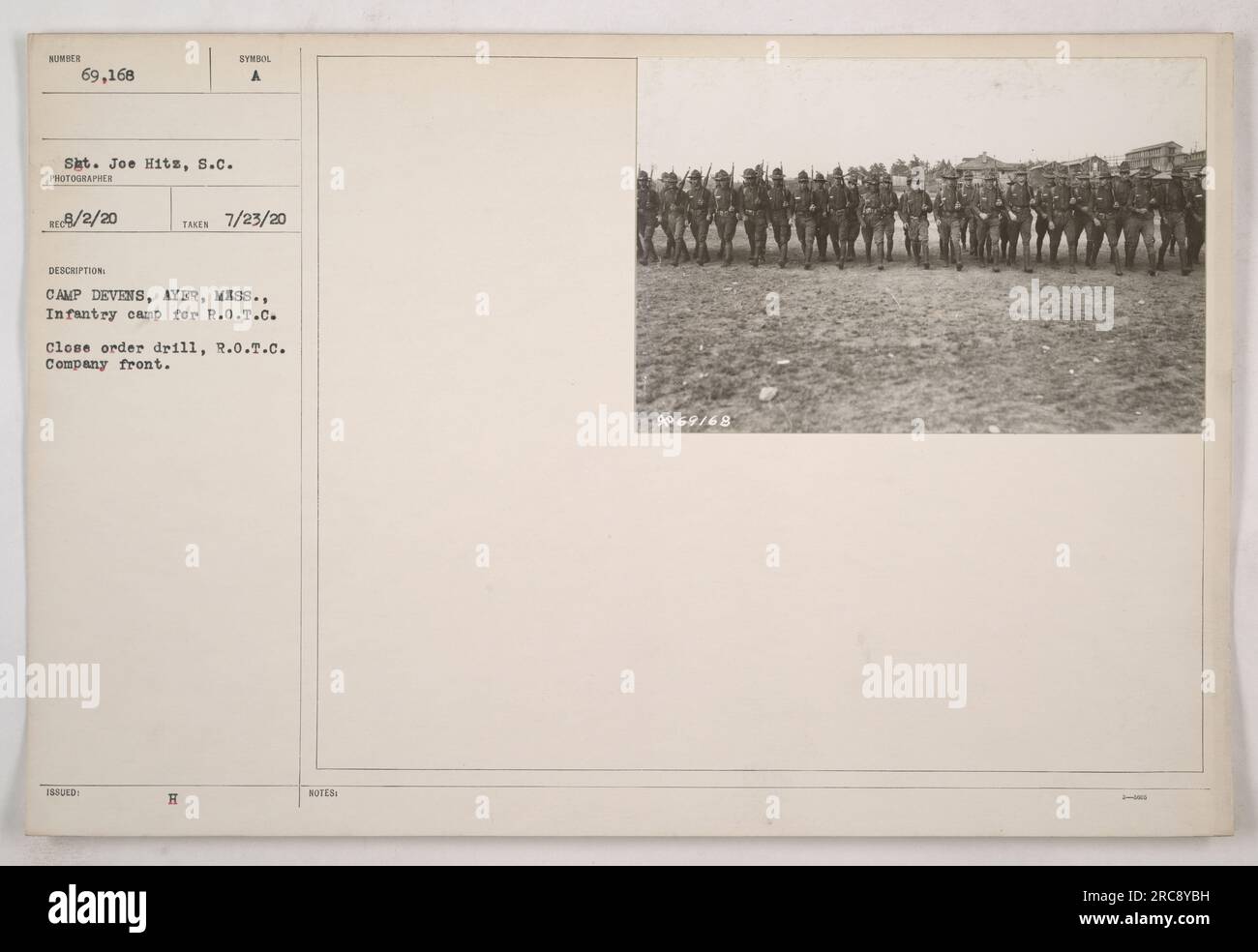 Soldiers engaged in close order drill at a R.O.T.C. infantry camp in Camp Devens, Ayer, Mass. The photo was taken by Sat. Joe Hitz, S.c. on July 23, 1920. Earlier, the soldiers formed the company front in R.O.T.C. code 069/68. Stock Photo