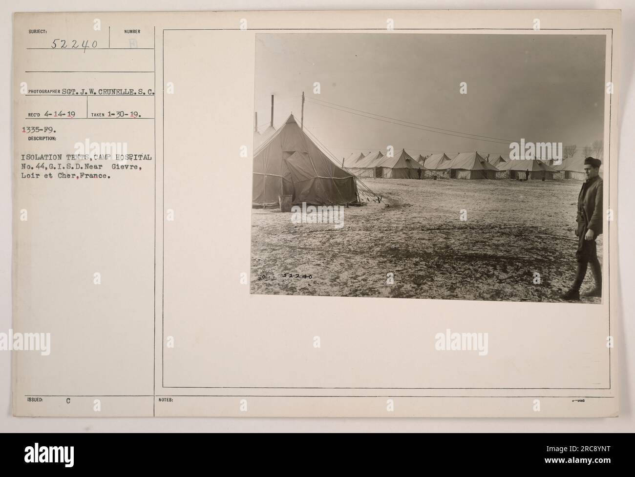 Isolation tents being issued at Camp Hospital No. 44, G.I.S.D. near Gievre, Loire et Cher, France. The photograph was taken on January 30, 1919, by Sergeant J.W. Crunelle. It is numbered 52240 and re Stock Photo