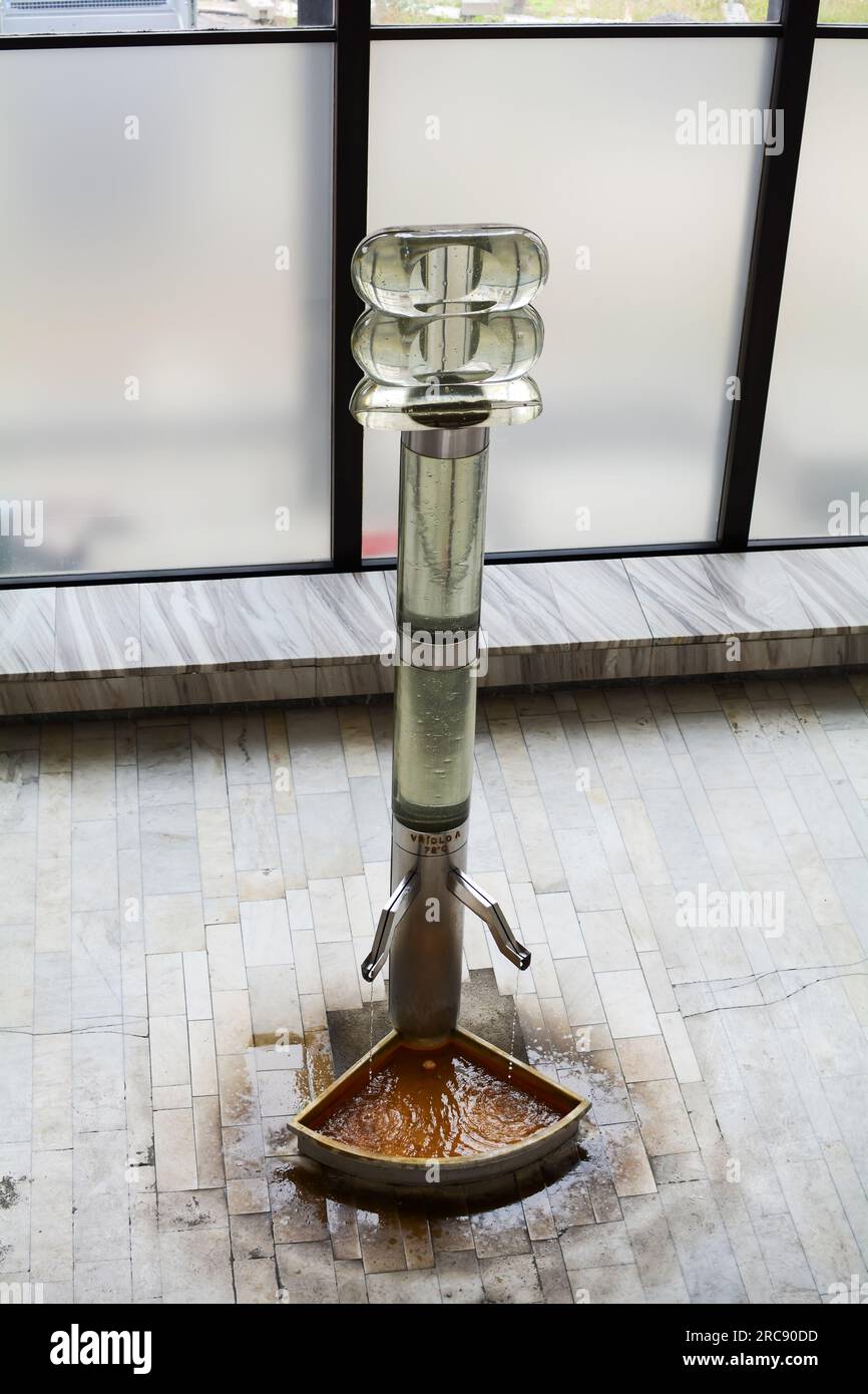 Vrdlo hot spring drinking fountain glass sculpture inside the Hot Spring Colonnade or Vridelni Kolonada. Stock Photo
