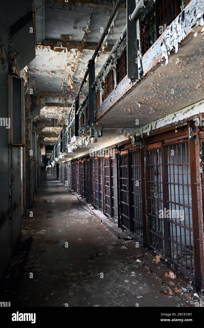 Looking down a row of prison cells in the East Cell Block of the Old Joliet Prison, which opened in 1858 and closed and was abandoned in 2002. Stock Photo