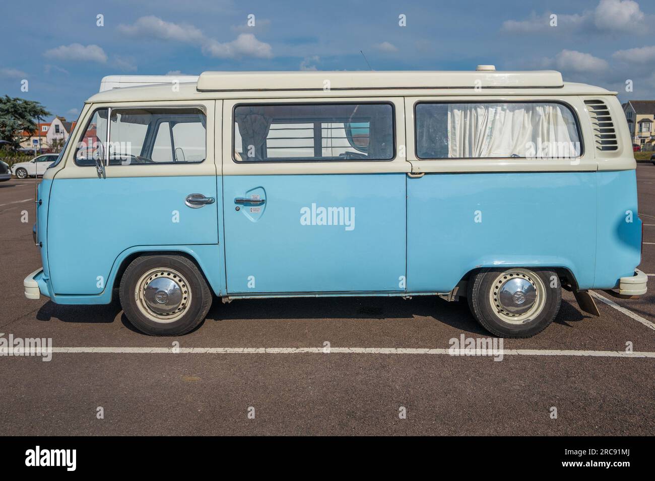 Light blue and white bay window Volkswagen VW T2 camper van. Stock Photo