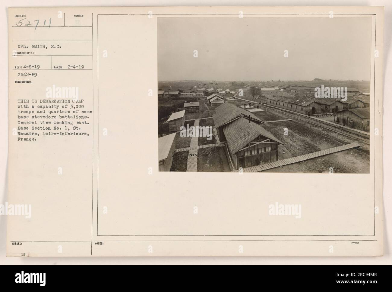 Image of Debarkation Camp in St. Nazaire, France. The camp had a capacity of 3,000 troops and housed base stevedore battalions. The photograph was taken on February 4, 1919, and captures a general view of the camp, looking east. Photographer: CPL. Smith, S.C. Stock Photo