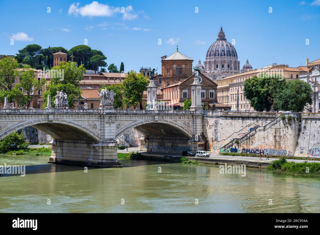 Ponte Sant' Angelo on the River Tiber, with dome of St. Peter's Basilica in background, in Rome, Lazio Region, Italy Stock Photo