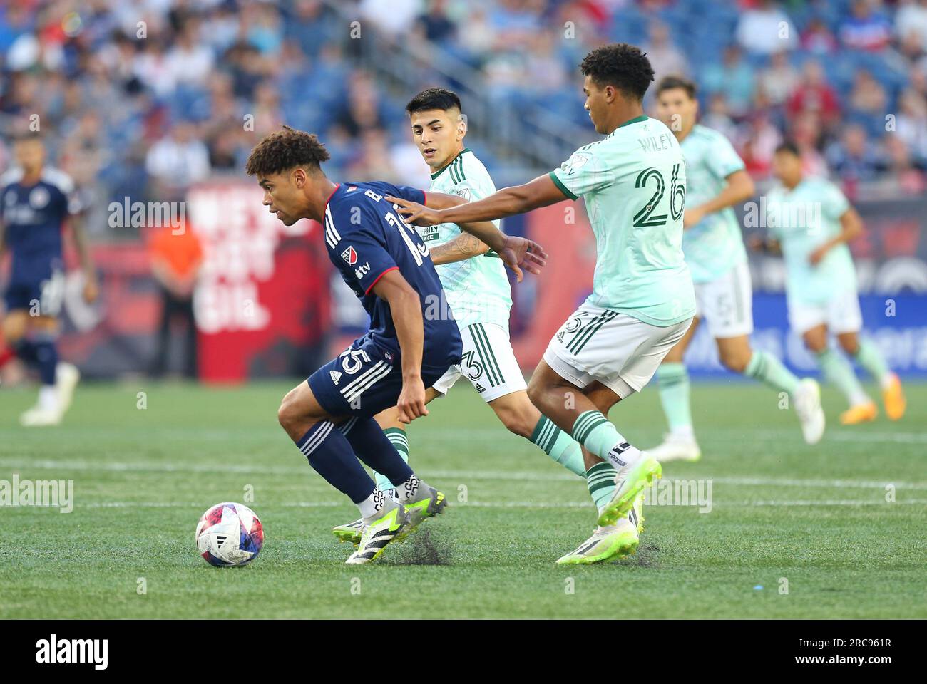 FOXBOROUGH, MA - APRIL 22: New England Revolution defender Brandon Bye (15)  lays the ball off during a match between the New England Revolution and  Sporting Kansas City on April 22, 2023