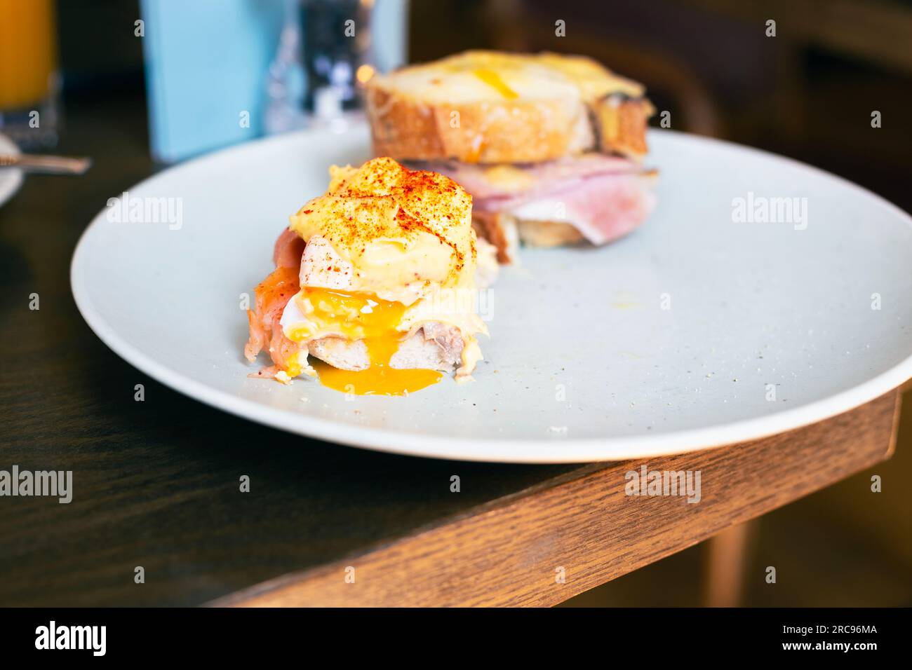 CROQUE MADAME, ham, cheese toasted sandwich, poached egg Stock Photo