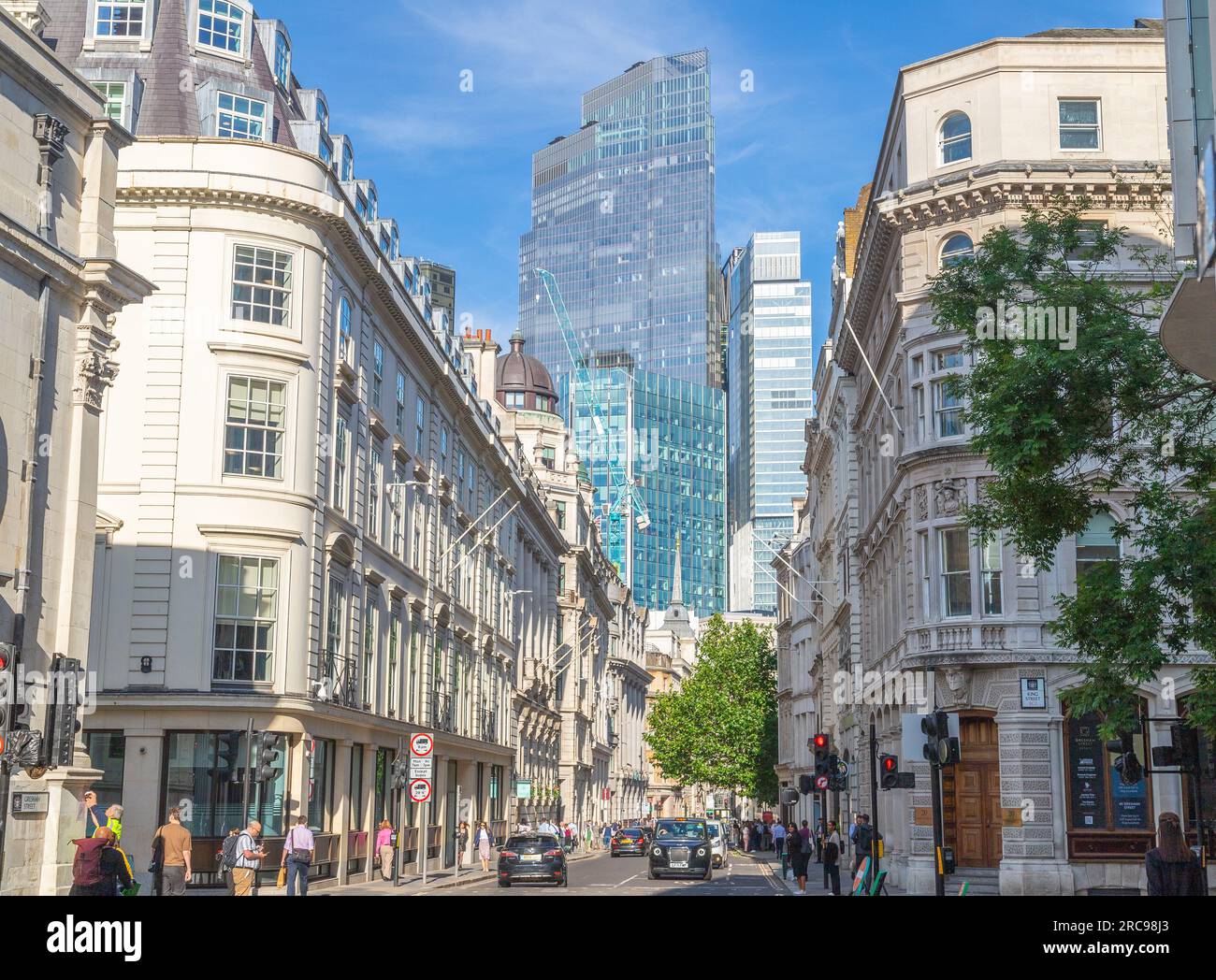 LONDON, UK - 6TH JULY 2023: Buildings and streets in the City of London, financial district. People can be seen. Stock Photo