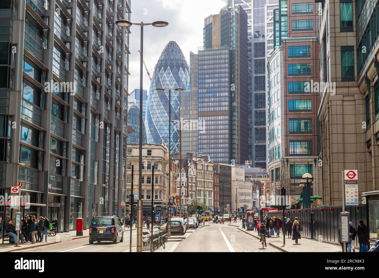 LONDON, UK - 2ND APRIL 2023: Buildings and offices along Bishopsgate in the business district at the City of London. People. can be seen on the street Stock Photo