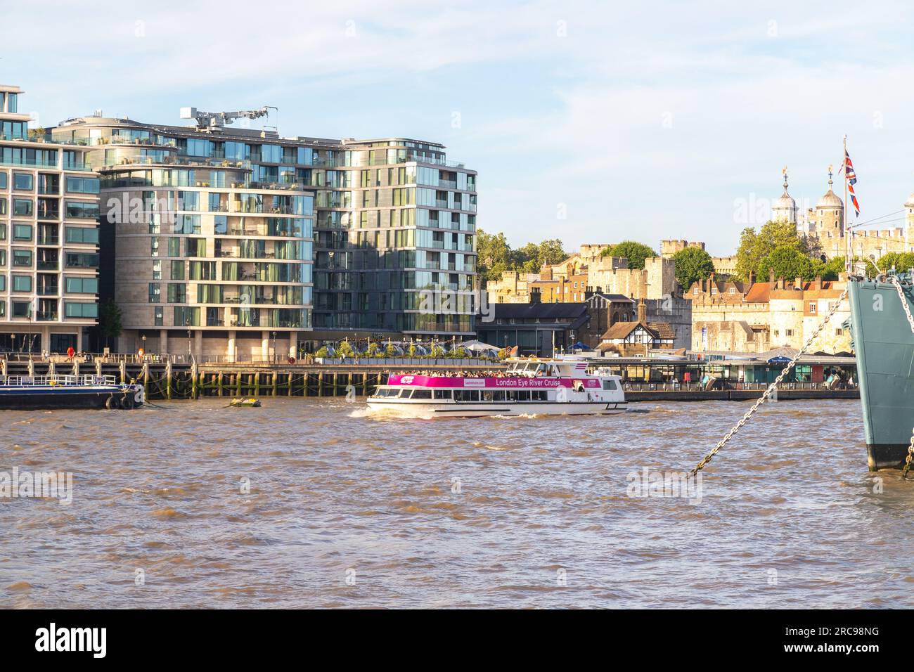LONDON, UK - 6TH JULY 2023: A London Eye River Cruise boat along the River Thames in central London during the day. People can be seen on the boat and Stock Photo
