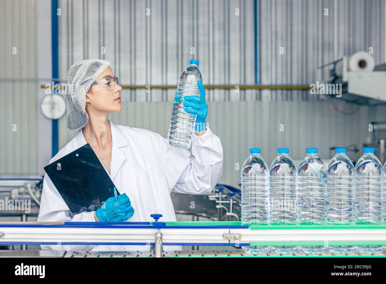 worker in drinking water factory. women workers caucasian labor in