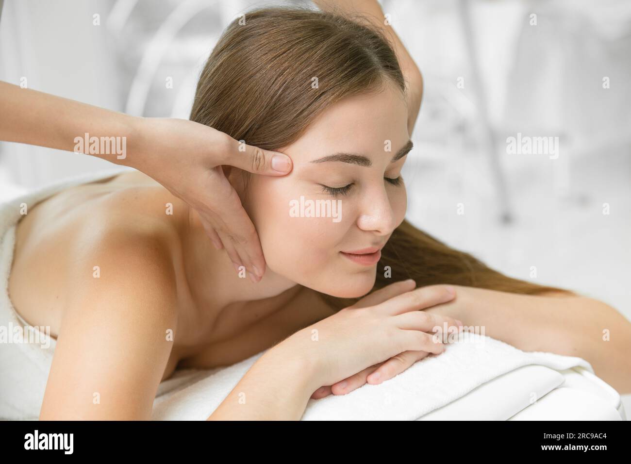 health care beauty women head massage in spa pain relief relax for healthy lifestyle. beautiful lady body care treatment closeup facial. Stock Photo