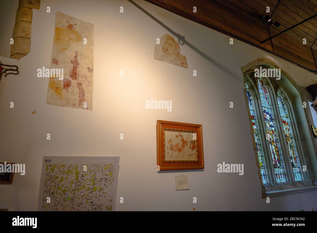 The interior north wall in St George's Parish Church in West Grinstead has restored remnants of old and faded, medieval murals. West Sussex, England. Stock Photo