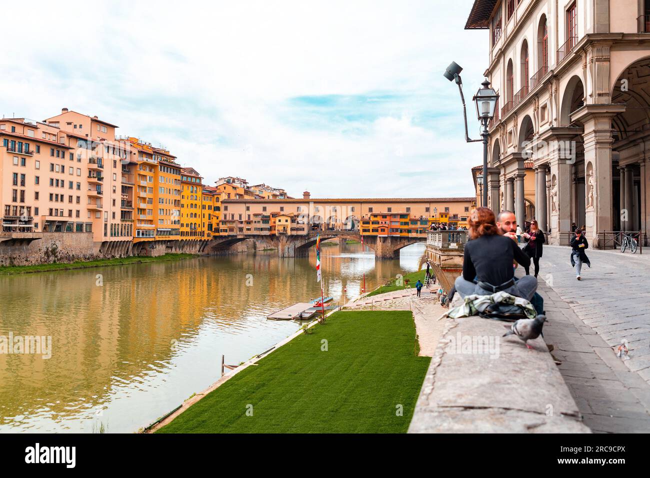 Florence, Italy - April 5, 2022: The Ponte Vecchio is a medieval stone ...