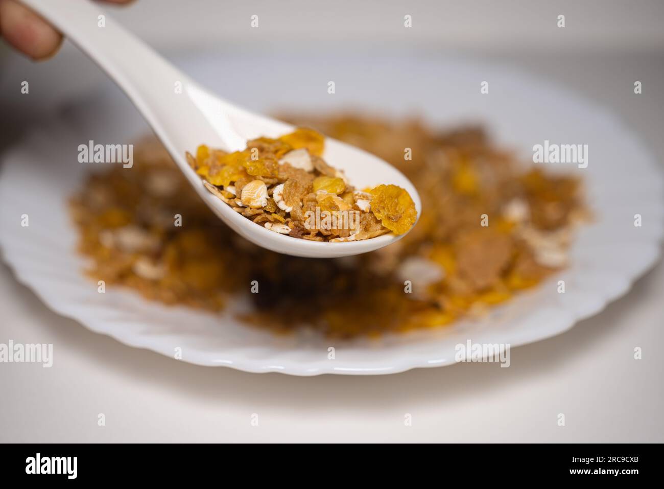 Close up of spoonful Muesli dry fruits, nut, oats, and seeds Stock Photo