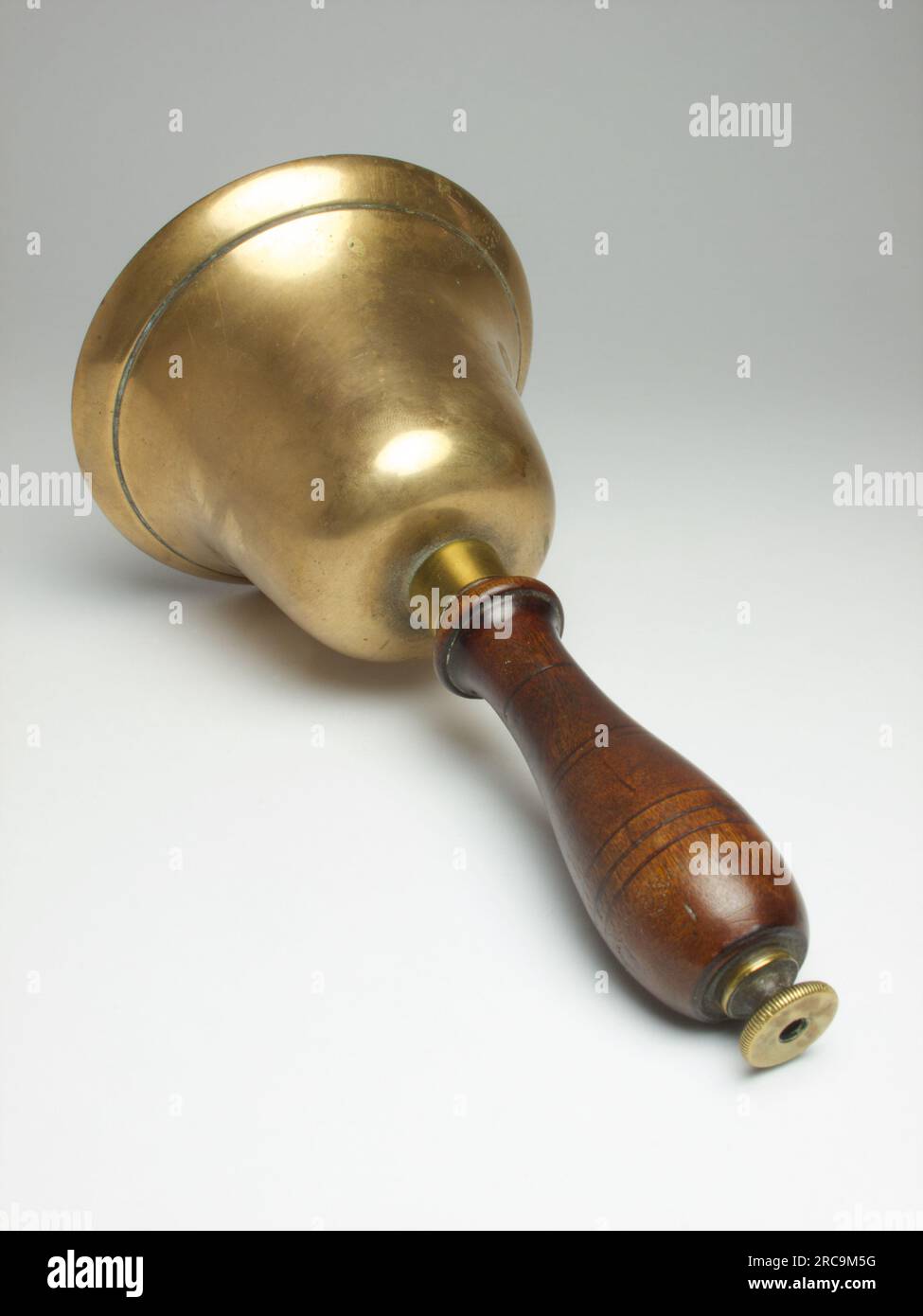 Antique bronze handbell with mahogany handle, made circa 1900 Stock