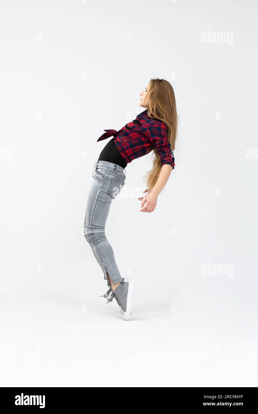Model performs complicated positions while posing for a photo Stock Photo