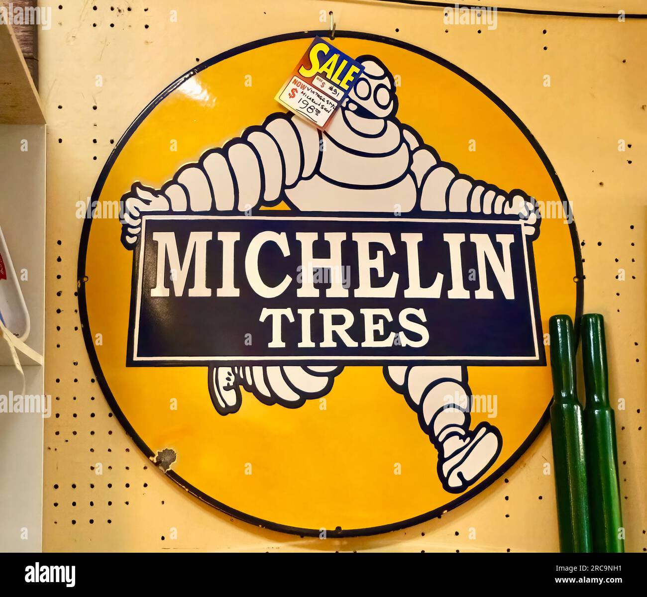 Photo of a sign with Bibendum Michelin Tyre Man for Michelin Tires for sale in an antiques shop  Snohomish Washington State USA Stock Photo