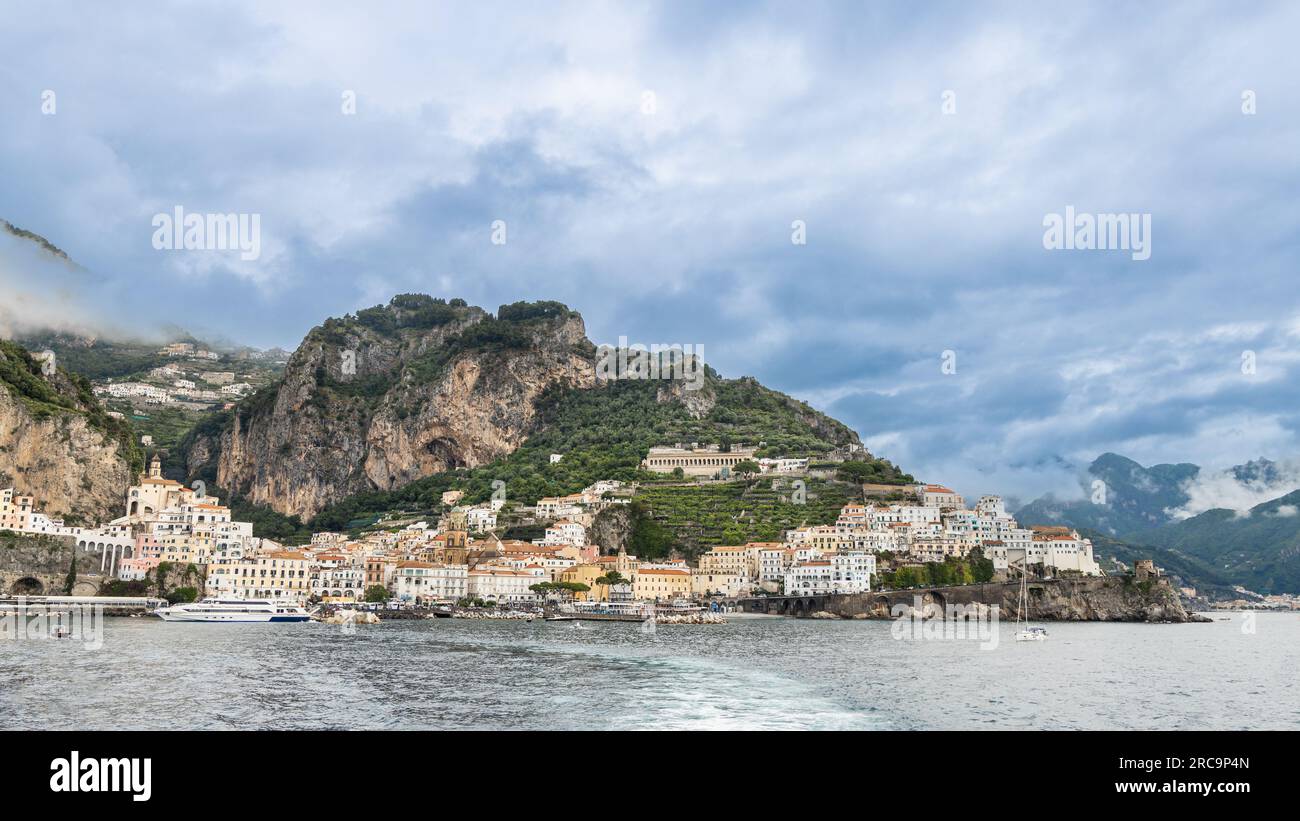 Panorama view of Amalfi, a town in dramatic natural setting below steep ...