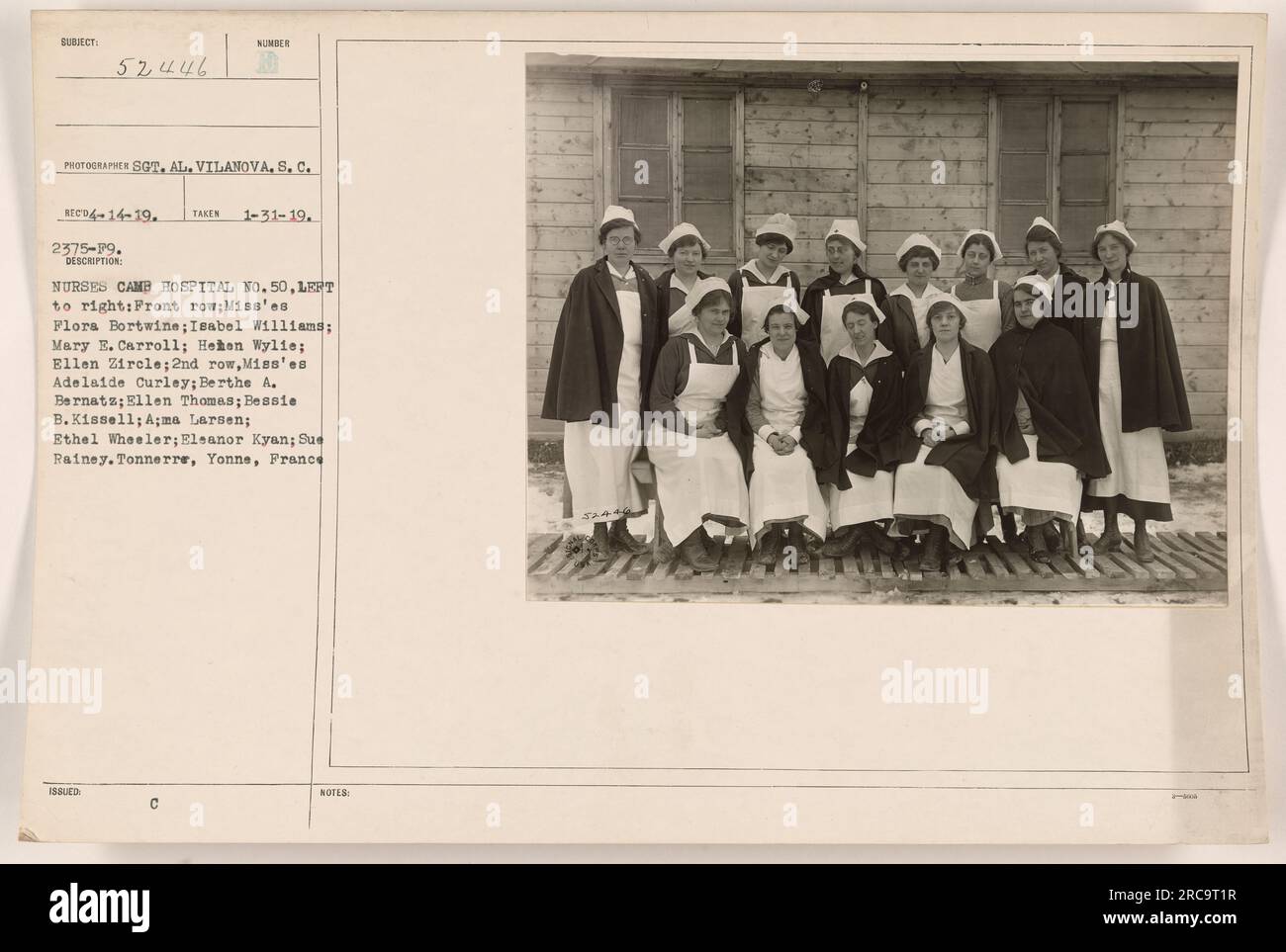 Nurses of Camp Hospital No. 50 in Tonnerre, Yonne, France, are pictured in this photograph. The image captures the front and second rows of nurses, along with their names. The photograph was taken by Sot. Al. Vilanova, S.C. on January 31, 1919, and received on April 14, 1919. The description includes details such as the names of the nurses and the location. Stock Photo