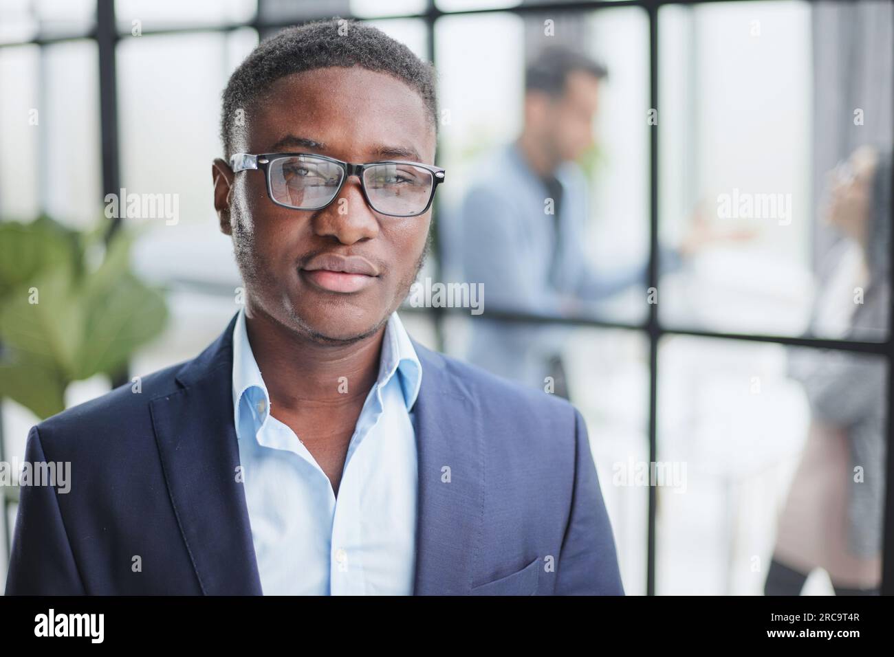 Handsome young man in design office posing at camera Stock Photo