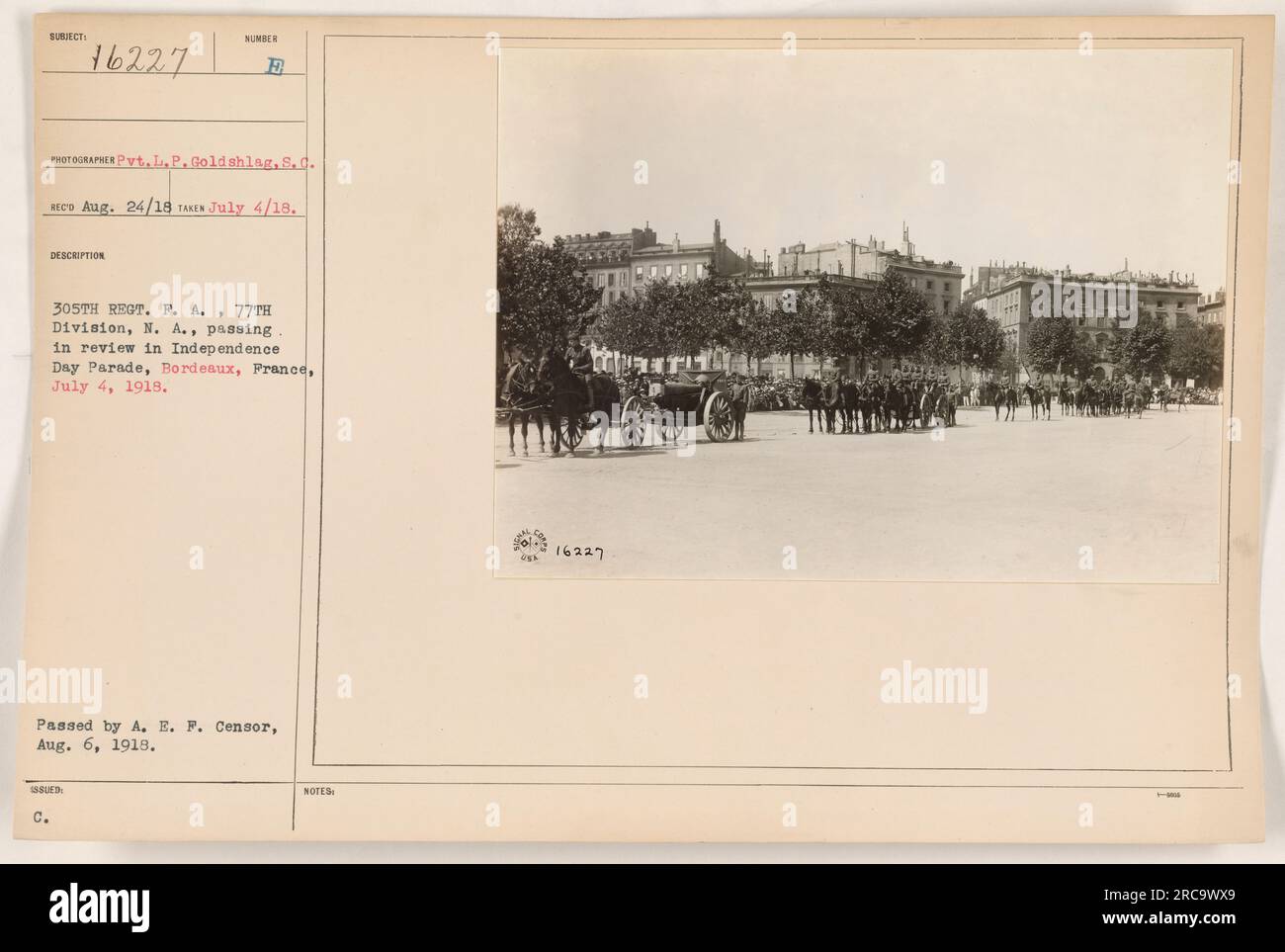 In this photograph taken by Pvt. L.P. Goldshlag on July 4, 1918, soldiers from the 305th Regiment, P.A., 77th Division, N.A. are seen passing in review during an Independence Day Parade in Bordeaux, France. This image was approved by the A.E.P. Censor on August 6, 1918. Stock Photo