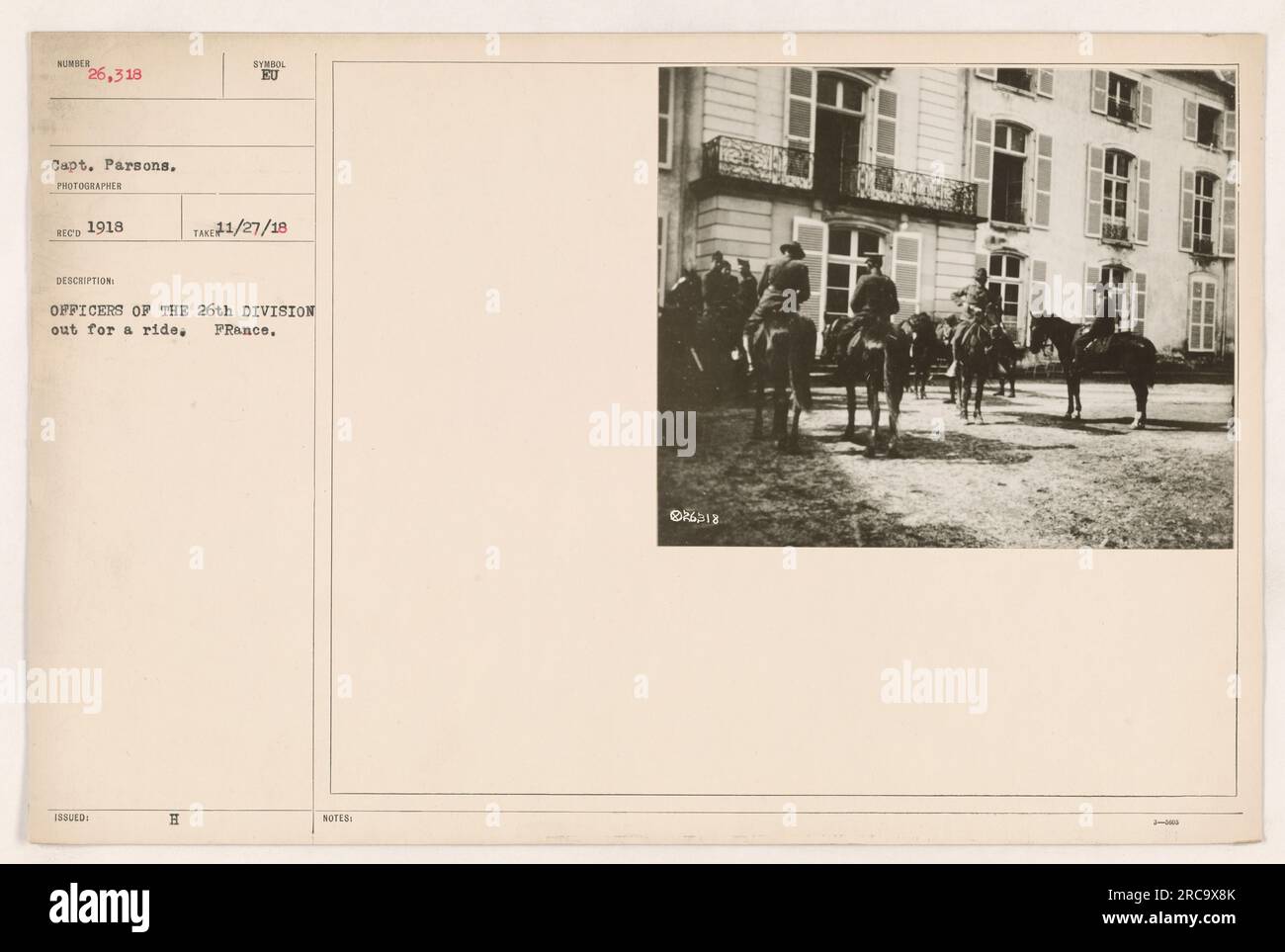Capt. Parsons, a photographer during World War One, captured this image (#26,318) of officers from the 26th Division enjoying a ride on horseback in France. The photo was issued in Synsol EU in 1918. It is noted that the image was taxed on November 27, 1918, and there are additional notes written: 826318. Stock Photo